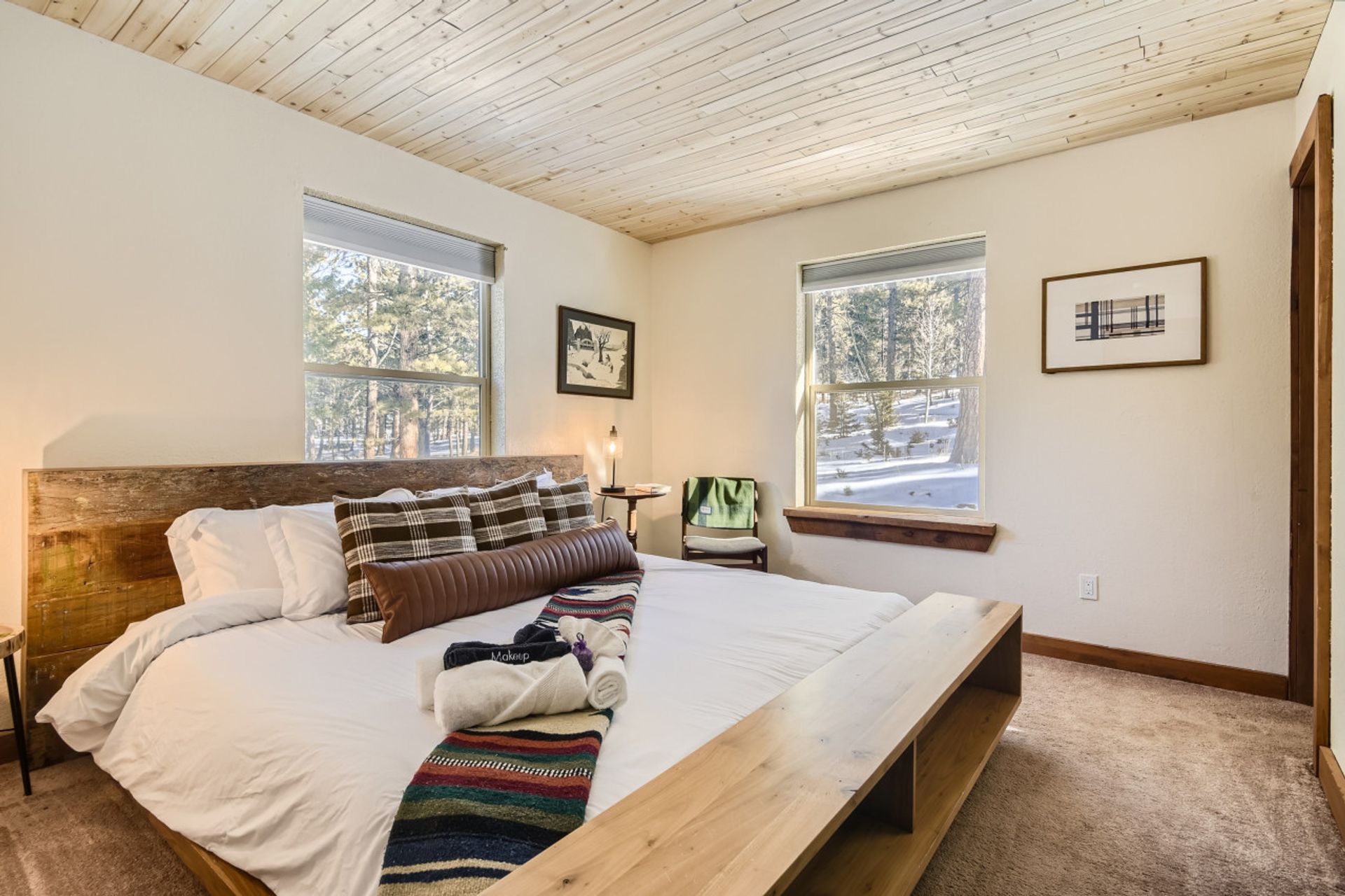 Bedroom with pine ceiling